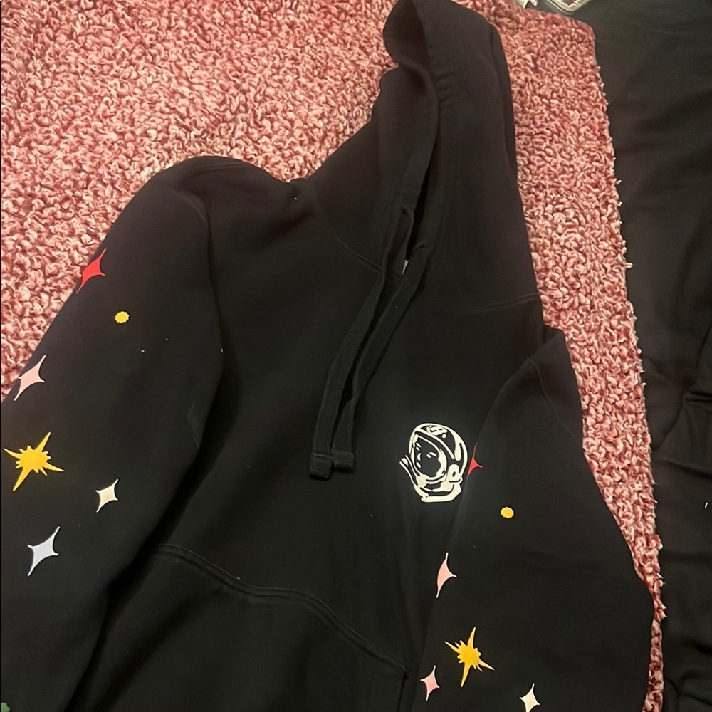 Black Hoodie with Astronaut Logo and Star Accents